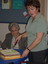 Client receiving some cake from brand launch