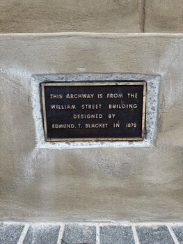 Plaque indicating builder of archway