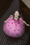 Girl spinning in a pink dress