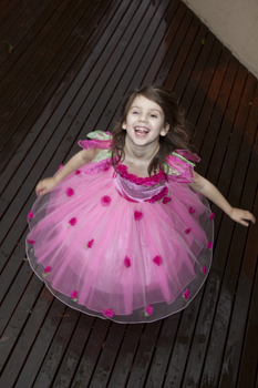 Girl spinning in a pink dress
