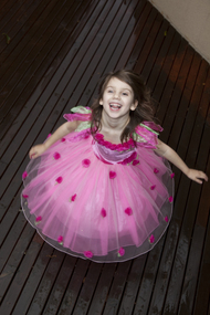 Girl spinning in a pink dress