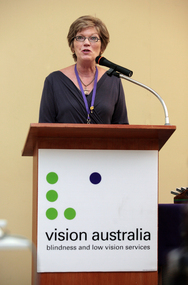 Julie McCallum at the podium