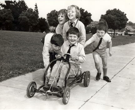Boys playing with a billy cart at Burwood