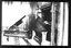 Male playing the organ with a piano behind him