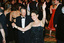 Women dancing with hand raised at ball
