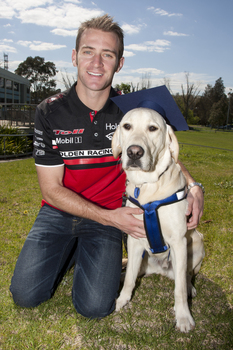 Will Davison with SEDA dog Davo with graduate cap