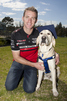 Will Davison with SEDA dog Davo with graduate cap