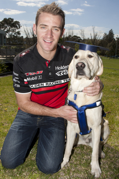 Will Davison with SEDA dog Davo with graduate cap