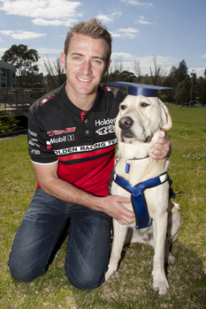 Will Davison with SEDA dog Davo with graduate cap
