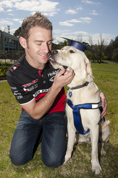Will Davison with SEDA dog Davo with graduate cap