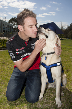 Will Davison with SEDA dog Davo with graduate cap