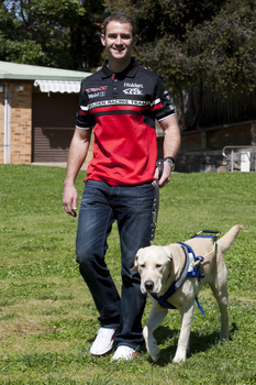 Will Davison walking with SEDA dog Davo 