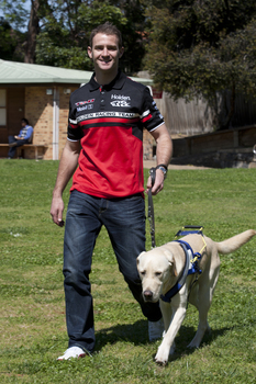 Will Davison walking with SEDA dog Davo 