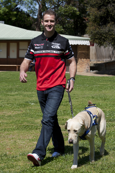 Will Davison walking with SEDA dog Davo 
