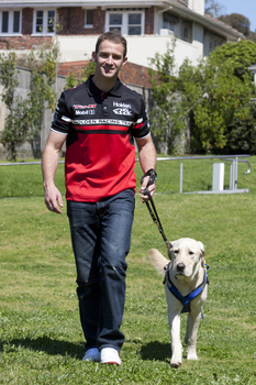 Will Davison walking with SEDA dog Davo 