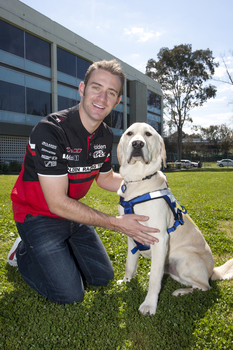 Will Davison with SEDA dog Davo at Kooyong