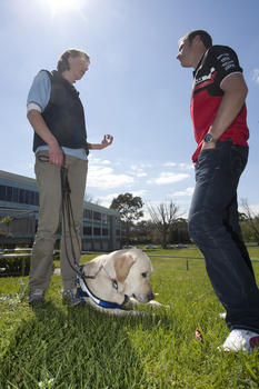 Will Davison with SEDA dog Davo and dog trainer