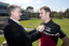 Gerard Menses pinning a VA badge on Will Davison at Kooyong