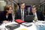 Lady, Chris Edwards and Bill Shorten view a PC