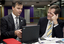 Chris Edwards and Bill Shorten view a PC
