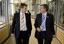 Bill Shorten and Gerard Menses walking outside library