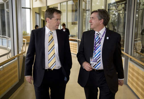 Bill Shorten and Gerard Menses walking outside library