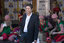 Steve Jacobs with elves wrapping behind him