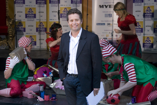 Steve Jacobs with the elves wrapping presents