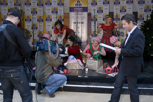 Steve Jacobs with the elves wrapping presents