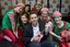 Steve Jacobs with the elves holding toys