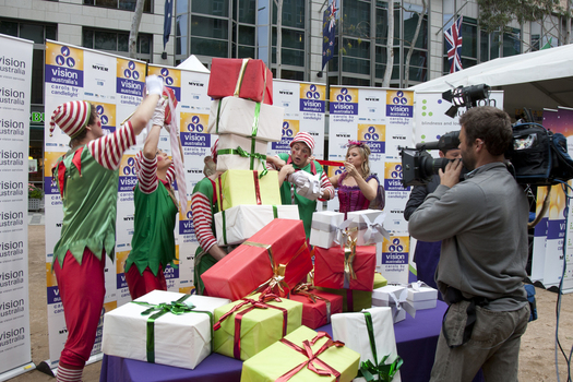 Elves stacking presents at the launch