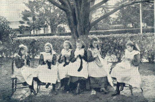 Girls sewing in girls playground at RVIB - not used in book
