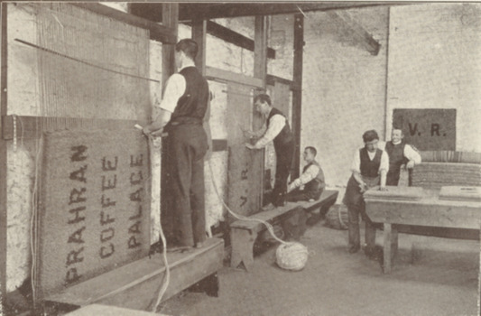 Inside mat workshop with workers standing on benches - not used in book