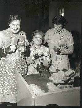 Three women holding brushes and smiling - page 118