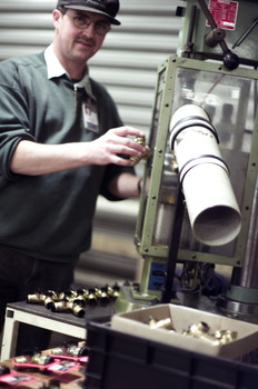 Terry Lord in the workshop with a pipe