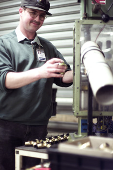 Terry Lord in the workshop with a pipe