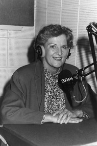 Hazel Hawke wearing headphones in recording studio