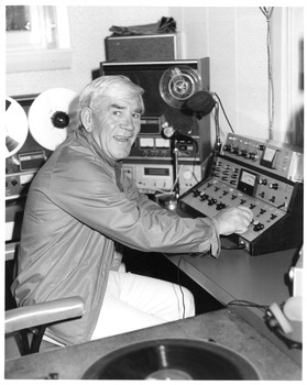 Lou Richards at producers desk in studio