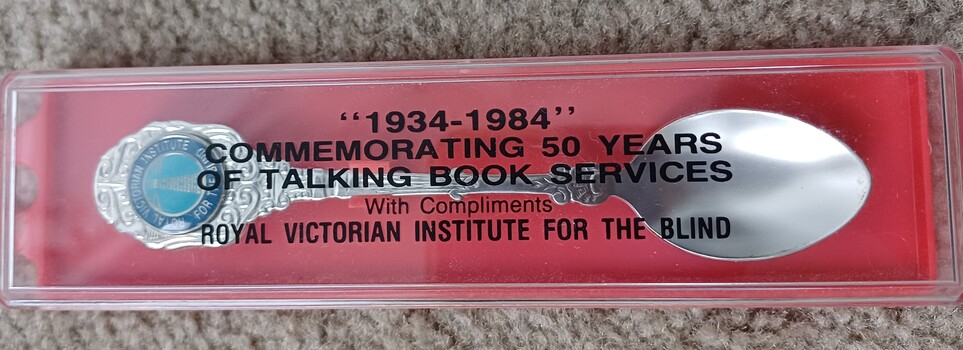 Metal teaspoon in box with inscription
