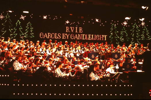 Orchestra and choir on stage at 1981 Carols by Candlelight