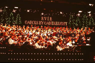 Orchestra and choir on stage at 1981 Carols by Candlelight