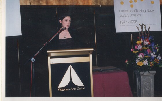 Rebecca Macauley reads from the podium