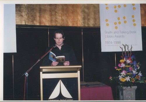 Stephen Pearse reads from the podium