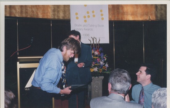 Rod Quantock speaking to Glen Morrow and James Wright, with Rose Blustein