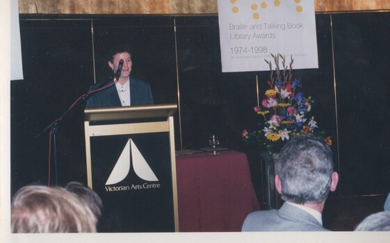 Rose Blustein speaking at the podium