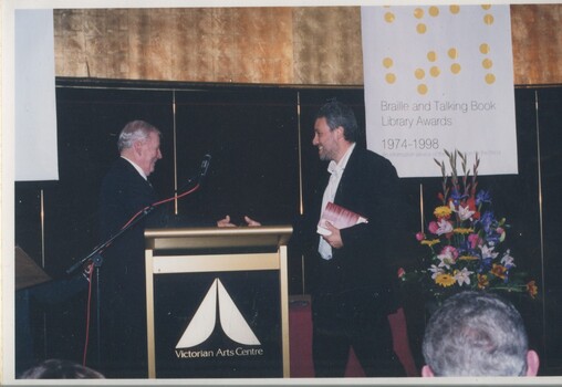 Bib Stillwell and Mark Raphael Baker at the podium