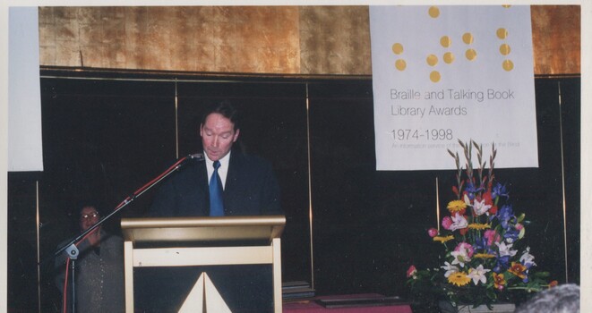 Unknown male at podium