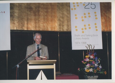 Stanley McGeagh reads from the podium