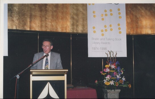 James Wright reads from the podium