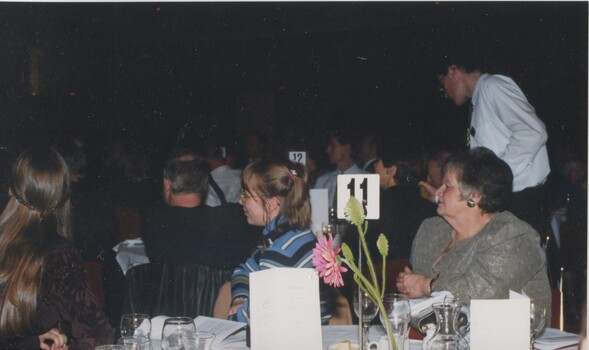 People at tables during the ceremony